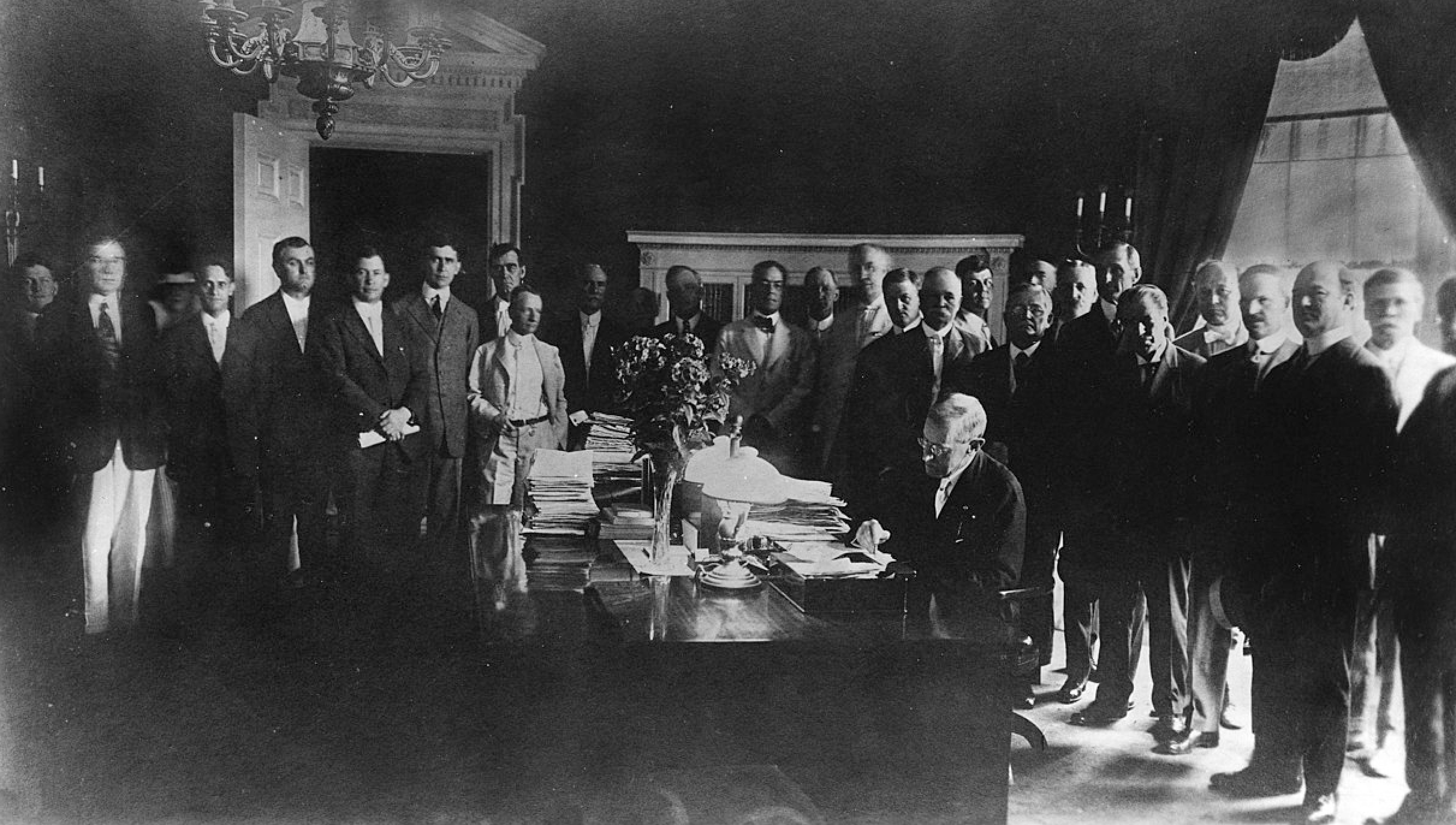 Photo of President Wilson signing Farm Credit Act