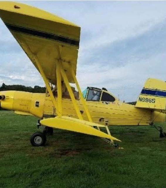 Yellow crop dusting airplane