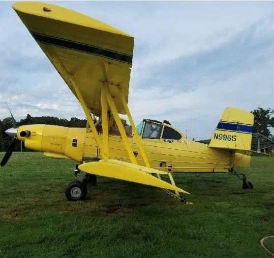 Yellow crop dusting airplane
